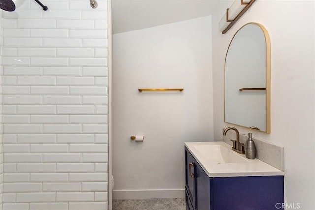 full bathroom featuring vanity, baseboards, walk in shower, and toilet