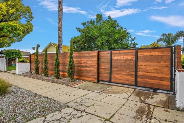 view of gate with fence