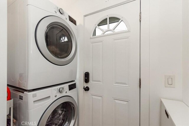 laundry area with laundry area and stacked washer and dryer