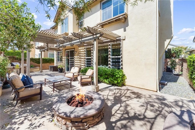 view of patio featuring a pergola, fence, and an outdoor living space with a fire pit