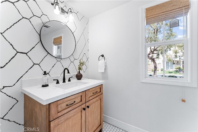 bathroom with baseboards and vanity