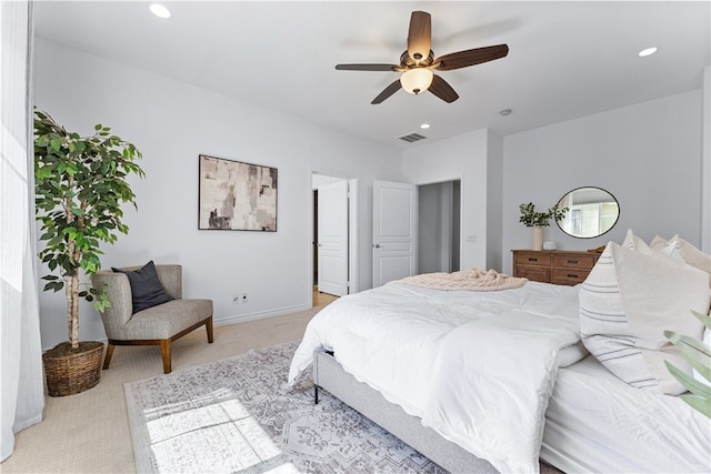 bedroom with light colored carpet, baseboards, a ceiling fan, and recessed lighting