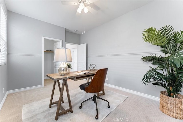 office with baseboards, a ceiling fan, and carpet