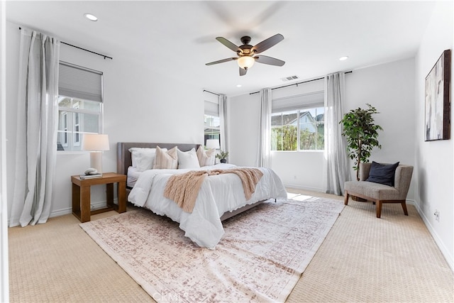 carpeted bedroom featuring baseboards, a ceiling fan, visible vents, and recessed lighting