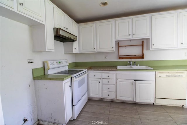 kitchen with under cabinet range hood, white cabinets, a sink, and white appliances