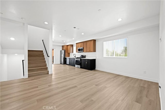 kitchen featuring light countertops, light wood-style flooring, stainless steel appliances, visible vents, and recessed lighting