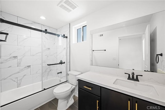 full bathroom with toilet, vanity, shower / bath combination with glass door, and visible vents