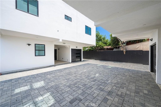 view of patio featuring fence