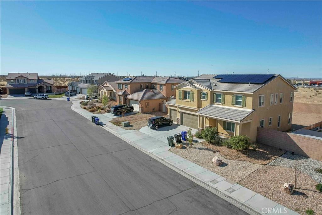 exterior space with curbs and a residential view