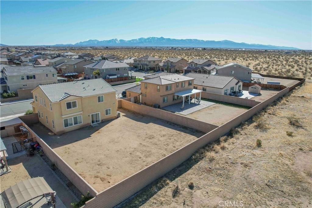 bird's eye view featuring a mountain view and a residential view