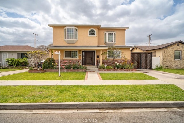 traditional-style home with a front yard, stucco siding, concrete driveway, and fence