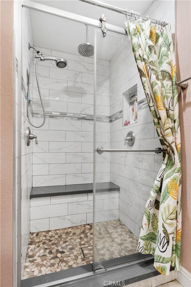 bathroom with a shower stall
