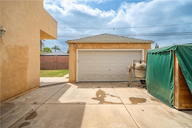 detached garage with fence