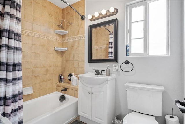 full bathroom featuring shower / tub combo with curtain, toilet, and vanity