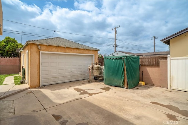 detached garage with fence