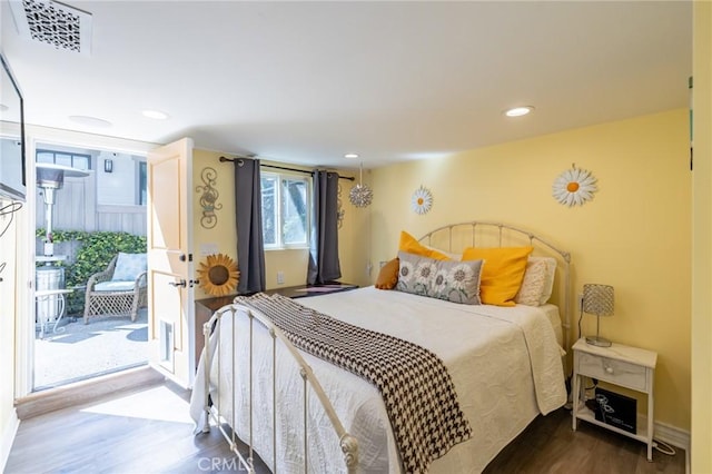 bedroom featuring visible vents, wood finished floors, baseboards, recessed lighting, and access to outside