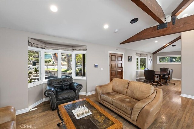 living room featuring recessed lighting, baseboards, lofted ceiling with beams, and wood finished floors
