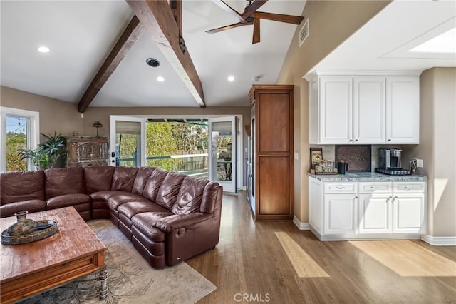 living area featuring recessed lighting, a wealth of natural light, and light wood-type flooring