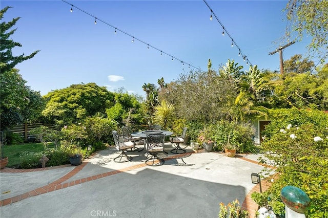 view of patio / terrace featuring fence