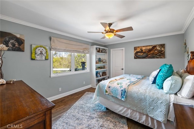 bedroom featuring crown molding, a ceiling fan, baseboards, and wood finished floors