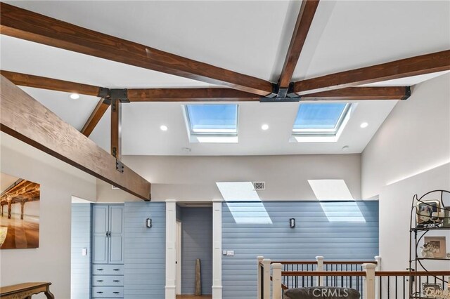 room details featuring a skylight, recessed lighting, beam ceiling, and visible vents