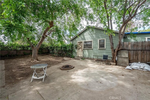 view of patio / terrace featuring a fenced backyard and an outdoor fire pit