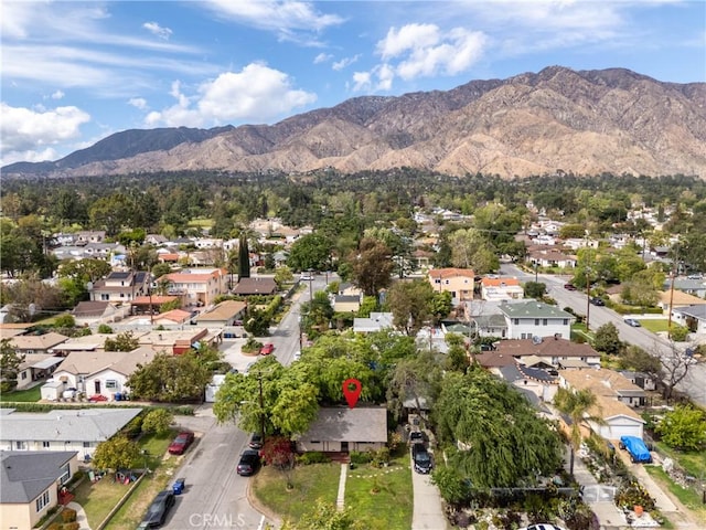 birds eye view of property featuring a mountain view and a residential view