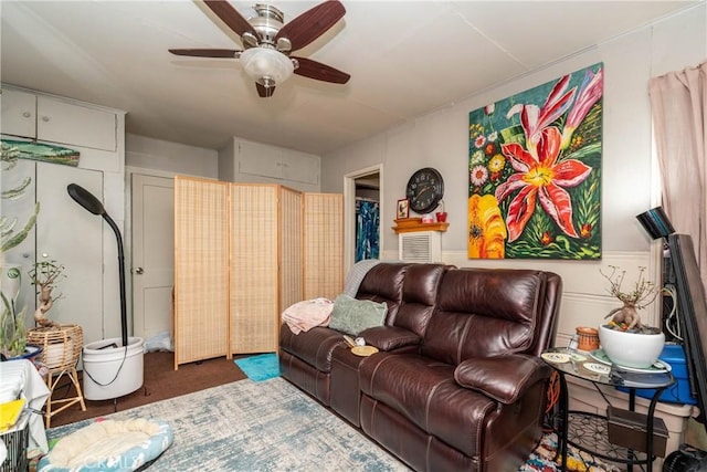 living area with ceiling fan