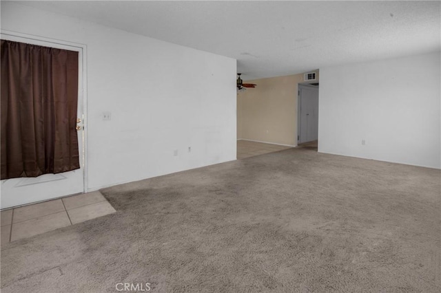 empty room with visible vents and carpet
