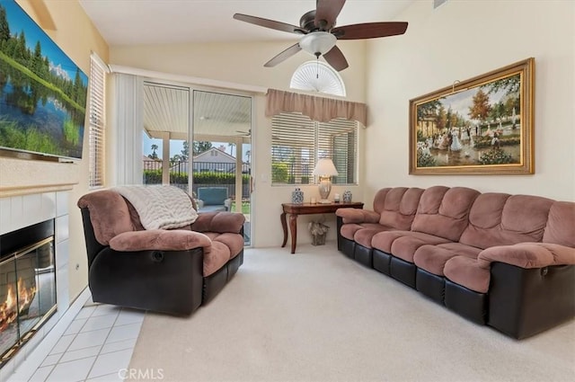40636 Via Jalapa, Murrieta, CA 92562 - living area with a tiled fireplace, ceiling fan, vaulted ceiling, and carpet floors