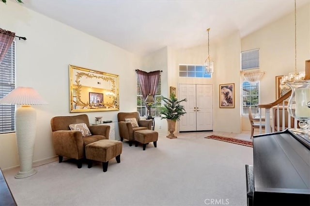 40636 Via Jalapa, Murrieta, CA 92562 - living area featuring carpet floors, a high ceiling, a notable chandelier, and baseboards