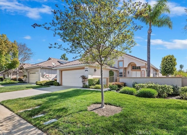 40636 Via Jalapa, Murrieta, CA 92562 - mediterranean / spanish-style house with stucco siding, an attached garage, fence private yard, and a front yard