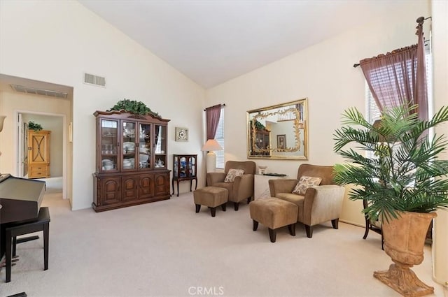 40636 Via Jalapa, Murrieta, CA 92562 - living area featuring visible vents, high vaulted ceiling, and light carpet