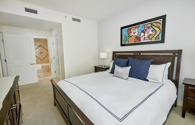 700 W E St Unit 2802, San Diego, CA 92101 - bedroom featuring light colored carpet, baseboards, and ensuite bathroom