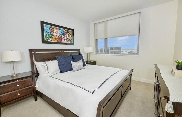 700 W E St Unit 2802, San Diego, CA 92101 - bedroom with light carpet and baseboards