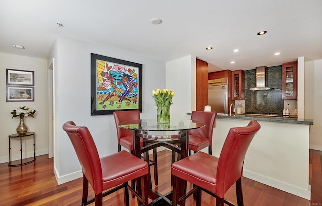 700 W E St Unit 2802, San Diego, CA 92101 - dining space featuring wood finished floors, recessed lighting, baseboards, and bar area