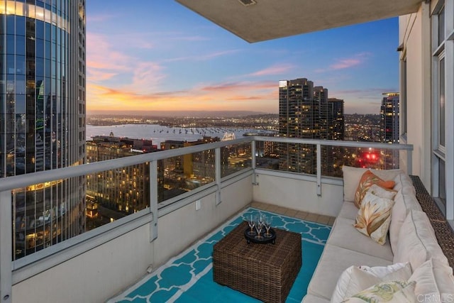 700 W E St Unit 2802, San Diego, CA 92101 - balcony at dusk with a water view, an outdoor hangout area, and a city view