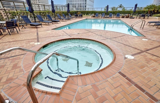 700 W E St Unit 2802, San Diego, CA 92101 - community pool featuring a hot tub, fence, a patio, and a city view
