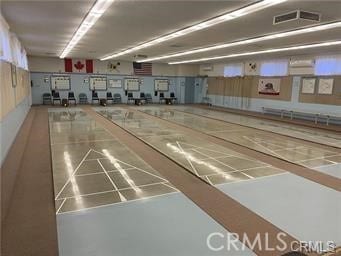 view of community featuring shuffleboard and visible vents