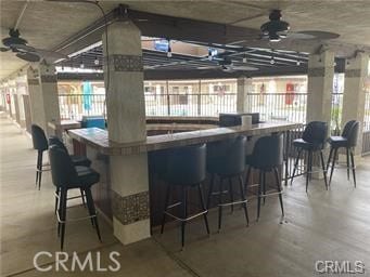 bar featuring a wealth of natural light