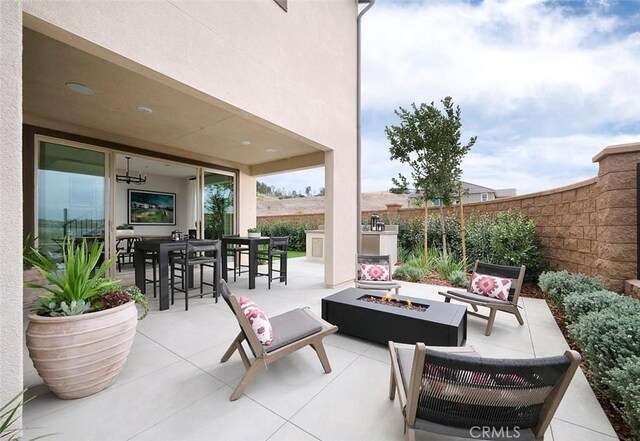 3816 Crossen Dr, Corona, CA 92883 - view of patio with outdoor dining area and an outdoor living space with a fire pit