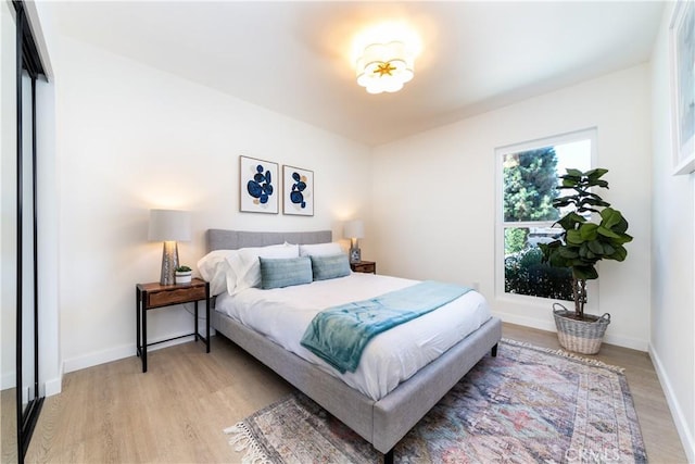 9038 Whitaker Ave, Northridge, CA 91343 - bedroom with light wood finished floors and baseboards