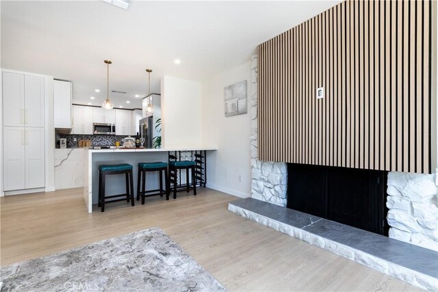 9038 Whitaker Ave, Northridge, CA 91343 - living room featuring light wood-style floors and recessed lighting