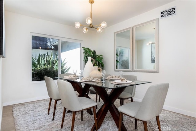 9038 Whitaker Ave, Northridge, CA 91343 - dining area with a chandelier and wood finished floors