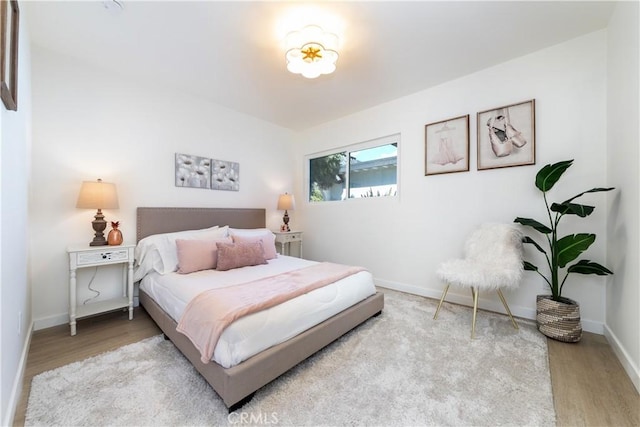 9038 Whitaker Ave, Northridge, CA 91343 - bedroom featuring wood finished floors and baseboards