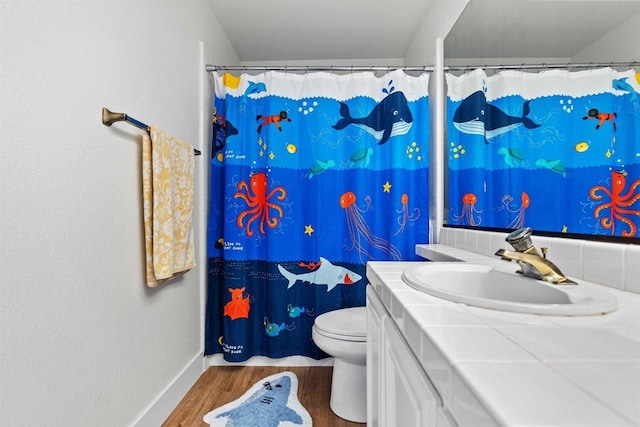 3702 Southridge Way, Oceanside, CA 92056 - bathroom featuring wood finished floors, vanity, toilet, baseboards, and a shower with curtain