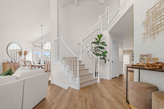 3702 Southridge Way, Oceanside, CA 92056 - staircase featuring high vaulted ceiling, wood finished floors, baseboards, a chandelier, and beam ceiling