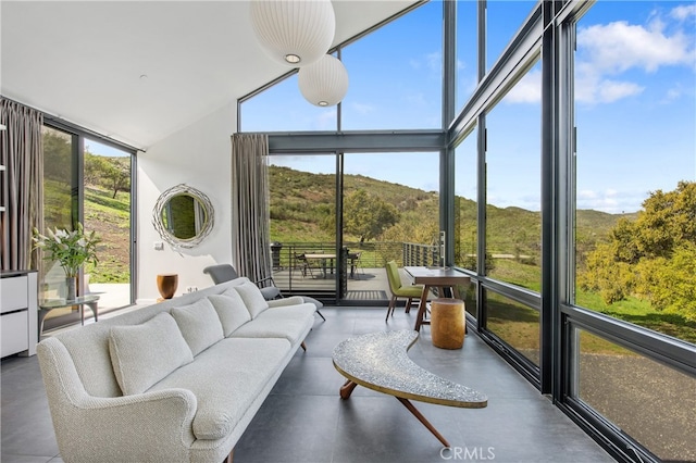 sunroom / solarium featuring a mountain view