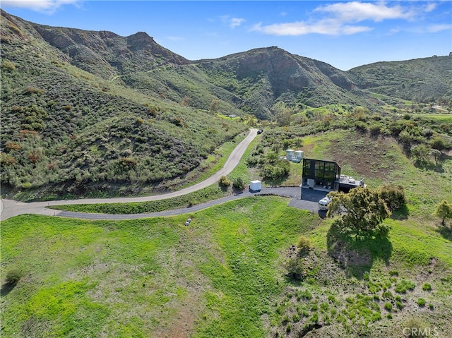 drone / aerial view featuring a mountain view
