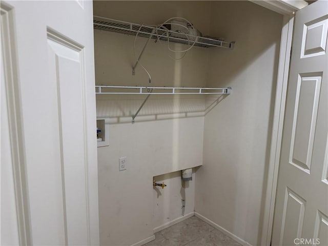 13312 Frederick Way, Sylmar, CA 91342 - laundry room featuring baseboards and hookup for a washing machine